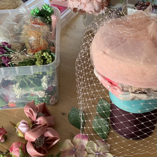 Powder pink Coquette pillbox hat with birdcage veil